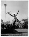 1956 16-year old Hugh Masekela leaping in the air, clutching the trumpet that had been sent to him by Louis Armstrong Photo Alf Kumalo.jpg